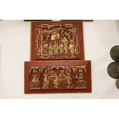 1465 - A quantity of south East Asian wood carvings including Chinese wood panels and an Indonesian carving... 