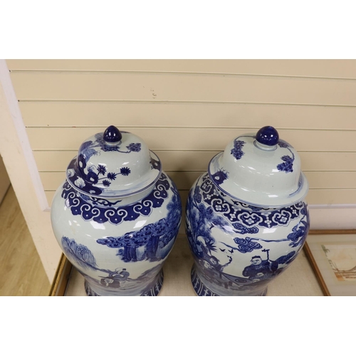 1479 - A pair of large Chinese blue and white jars and covers, 75 cms high.