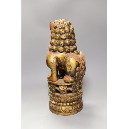 1491 - A South East Asian painted wood Buddhist lion