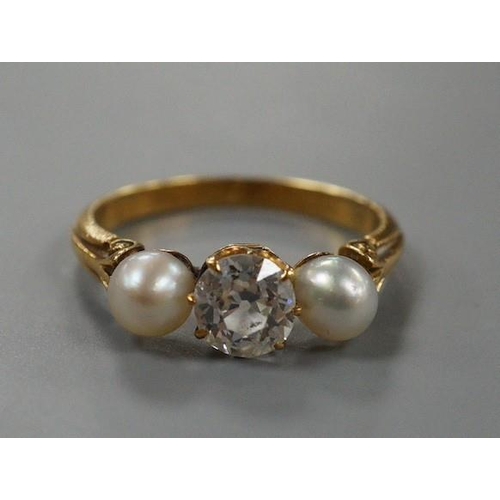 1941 - A yellow metal, cultured pearl and diamond set three stone ring, size L, gross weight 3 grams, the d... 