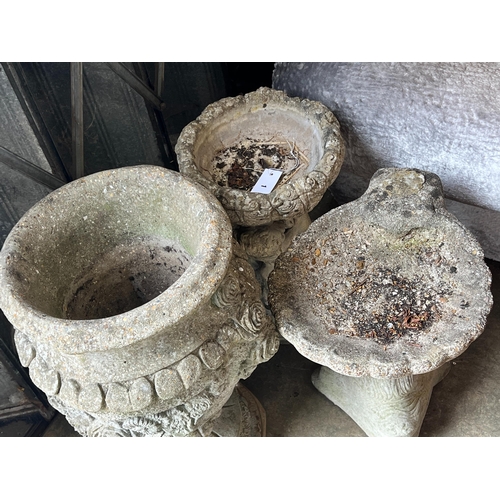 1 - A reconstituted stone garden urn, height 63cm together with two stone bird baths