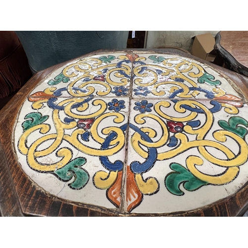 103 - An octagonal oak tile top occasional table, width 42cm, height 46cm and a circular oak work table... 