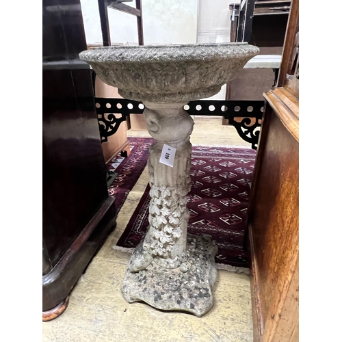 109 - A circular reconstituted stone garden bird bath, diameter 40cm, height 74cm