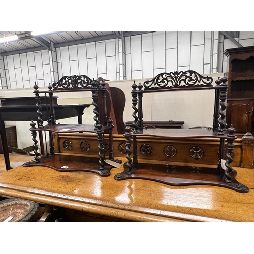 111 - A pair of Victorian rosewood serpentine three tier wall brackets, (altered), width 50cm, depth 20cm,... 