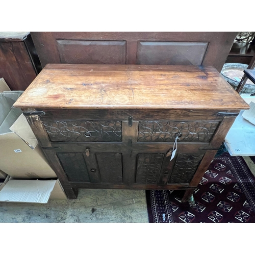 122 - An Indian carved hardwood side cabinet, width 97cm, depth 41cm, height 93cm