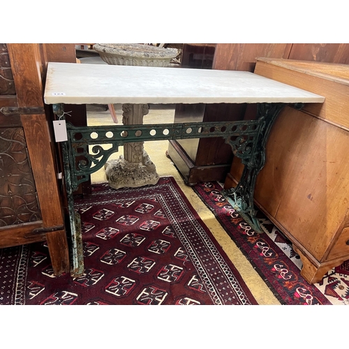 124 - A rectangular marble top cast iron garden table, length 91cm, width 48cm, height 70cm