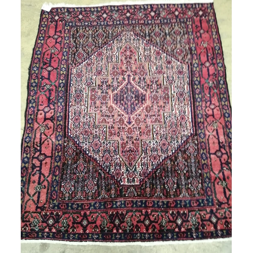 130 - A North West Persian blue ground rug 142cm x 117cm.