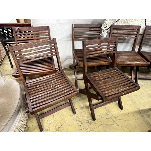 136 - A set of six slatted teak garden chairs