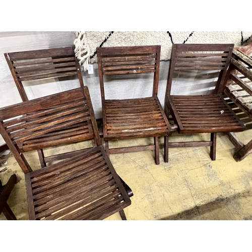 136 - A set of six slatted teak garden chairs