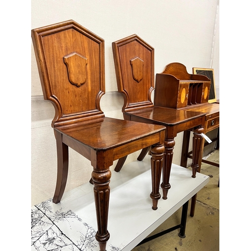 140 - A pair of Victorian mahogany hall chairs