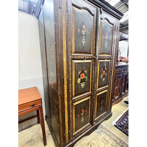 144 - An Indian painted hardwood two door cupboard, width 120cm, depth 70cm, height 185cm