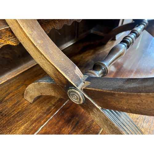 151 - A Regency style mahogany X framed stool, upholstered with a fragment of 17th century Aubusson tapest... 