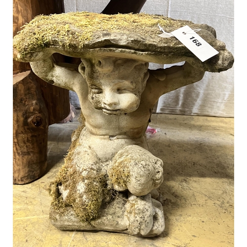 156 - A reconstituted stone Faun garden seat, width 48cm height 46cm