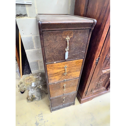 157 - An early 20th century oak four drawer filing cabinet, width 45cm, depth 64cm, height 141cm