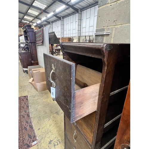 157 - An early 20th century oak four drawer filing cabinet, width 45cm, depth 64cm, height 141cm