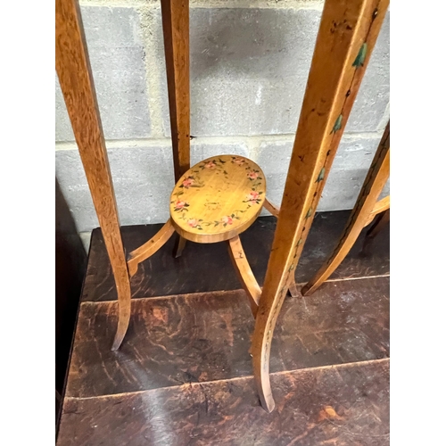 159 - A pair of oval Sheraton style painted satinwood two tier plant stands, width 32cm, depth 26cm, heigh... 