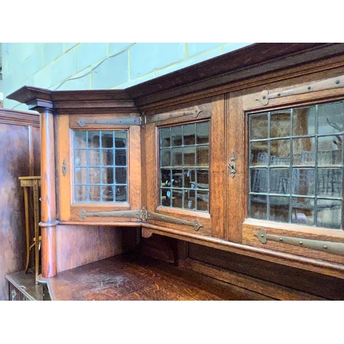 161 - An early 20th century Arts & Crafts copper mounted oak sideboard in the manner of Shapland and Pette... 