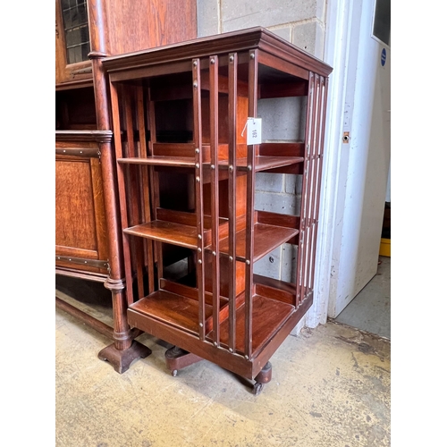 162 - An Edwardian walnut revolving bookcase, width 60cm, height 120cm