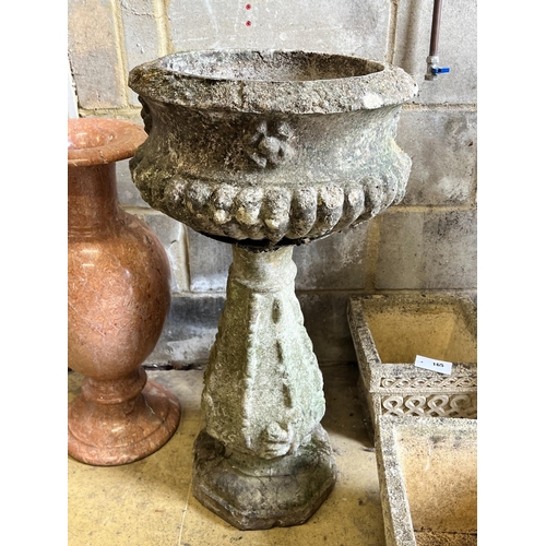 164 - A reconstituted stone circular garden fountain, diameter 43cm, height 84cm