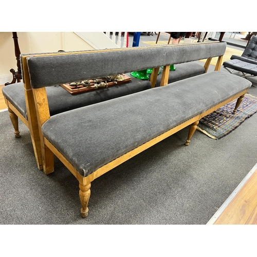 193 - A pair of late Victorian pale oak upholstered benches, length 242cm, depth 48cm, height 80cm