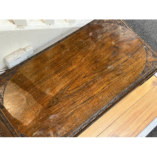 194 - A Chinese carved hardwood low table, length 91cm, depth 41cm, height 27cm