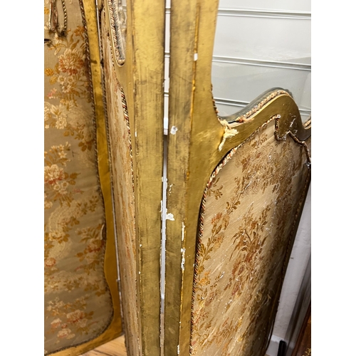 203 - A Louis XV style carved glazed giltwood three fold dressing screen, height 185cm