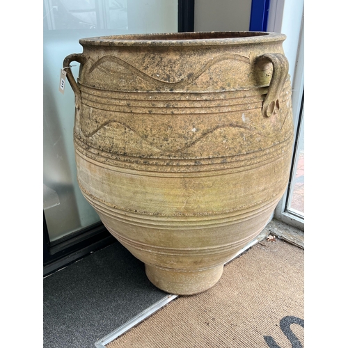 211 - A large Grecian style incised terracotta oil jar, height 99cm