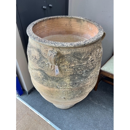 212 - A large Grecian style incised terracotta oil jar, height 105cm