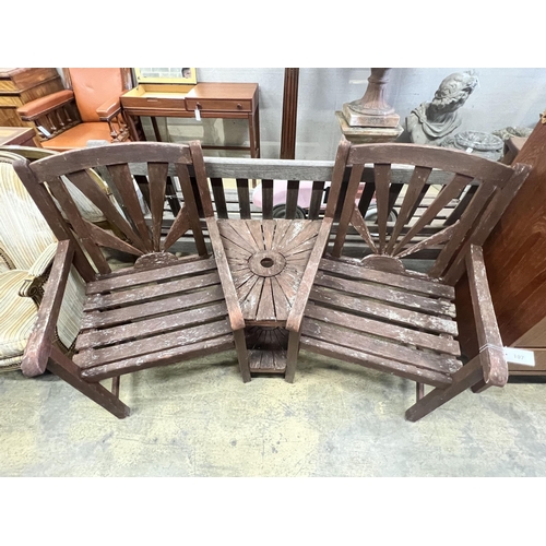 23 - A stained teak duet garden bench, length 156cm, depth 54cm, height 94cm