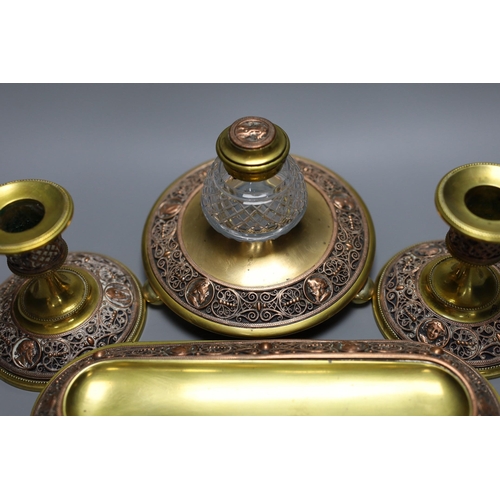 255 - A 19th century brass and copper filigree desk set, 23cm