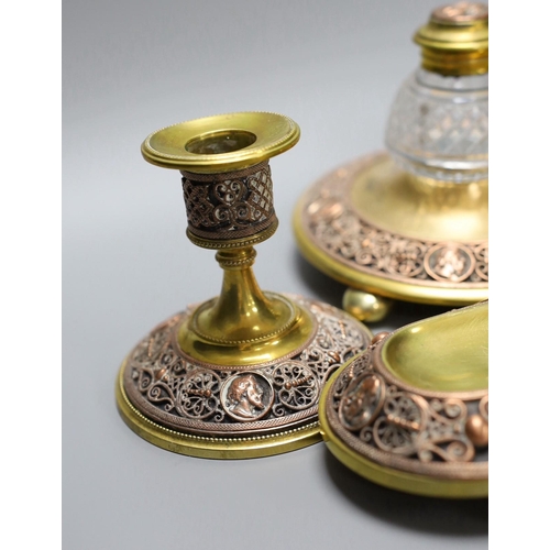 255 - A 19th century brass and copper filigree desk set, 23cm