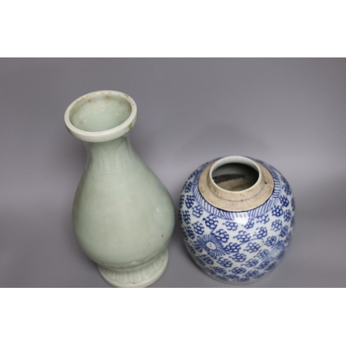 261 - A Chinese celadon ground vase and a similar blue and white jar, tallest 30cm