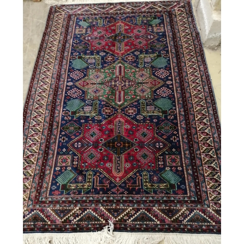 27 - A Caucasian blue ground rug, 186 x 124cm