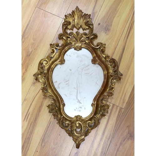 292 - A reproduction gilt framed wall mirror, in the Rococo style, 73cm tall