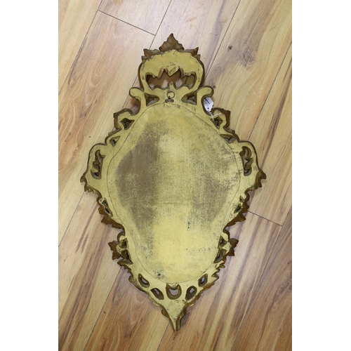 292 - A reproduction gilt framed wall mirror, in the Rococo style, 73cm tall