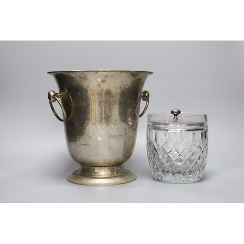 293 - A silver plated wine cooler, a silver topped decanter and a silver lidded cut glass biscuit barrel... 