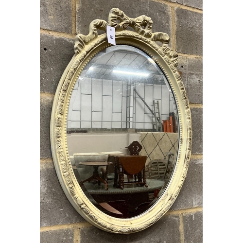 30 - A Victorian style oval painted wall mirror, width 58cm, height 84cm