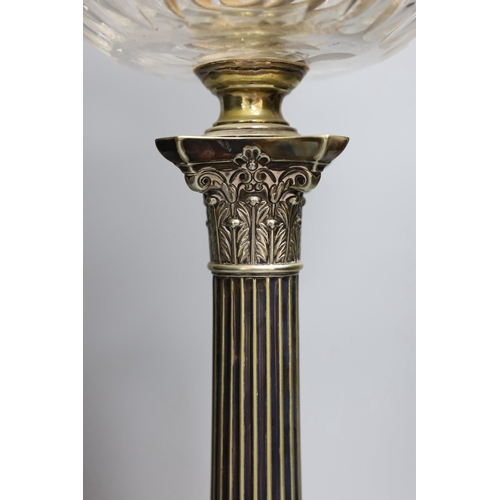 301 - A Victorian silver plated Corinthian column oil lamp, with a glass reservoir