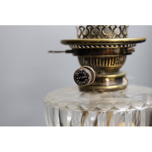 301 - A Victorian silver plated Corinthian column oil lamp, with a glass reservoir