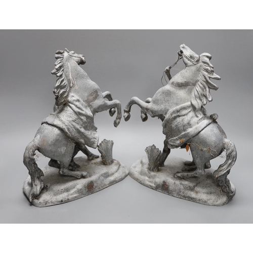 303 - A pair of 19th century spelter Marli horse groups, 29cm