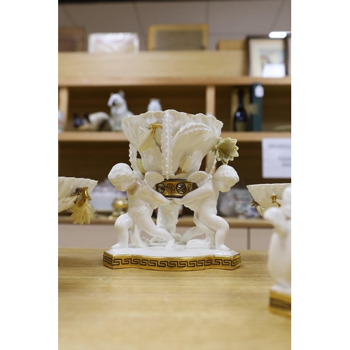 312 - Six pieces of Moore Bros. white glazed gilt edged porcelain, including a set of four comport, 20cm t... 