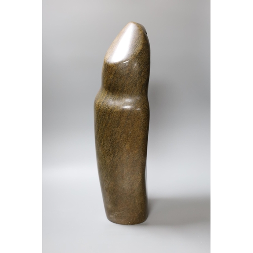 326 - A Zimbabwean carved and polished stone slender abstract figure, 48cm tall