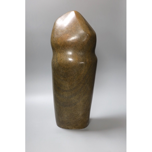 326 - A Zimbabwean carved and polished stone slender abstract figure, 48cm tall