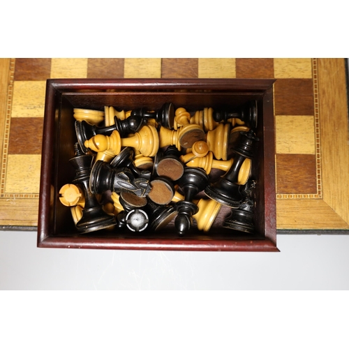 329 - Two complete wood carved cased chess set pieces, king: 8cm and 7.5cm tall, together with a playing b... 