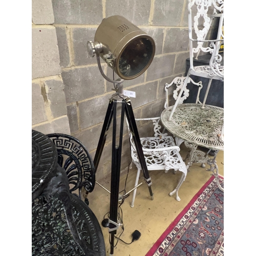 33 - A modern searchlight style floor lamp, on a folding tripod base, height 144cm