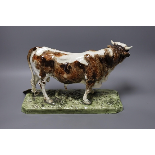 330 - After Pierre Jules Mene (1810-1879) - a faience model of a bull, 'Taureau Normand', impressed signat... 