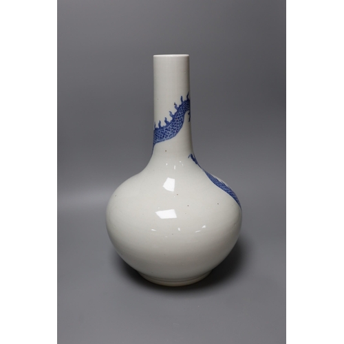 332 - A Chinese blue and white dragon bottle vase, 37cm tall