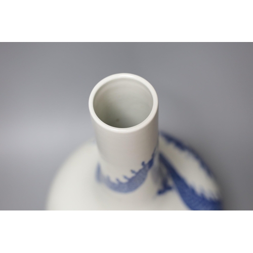 332 - A Chinese blue and white dragon bottle vase, 37cm tall