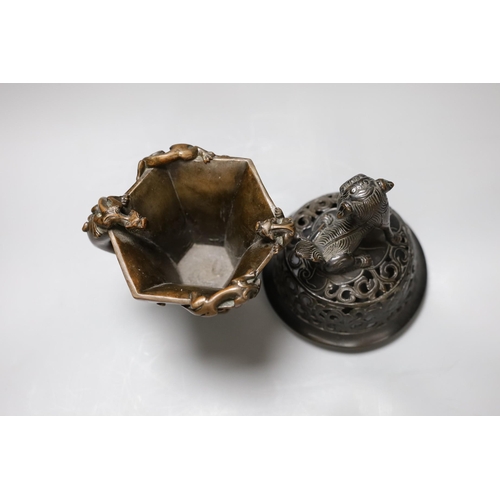 338 - A Chinese bronze handled libation cup, together and a bronze cover with pierced decoration and seate... 