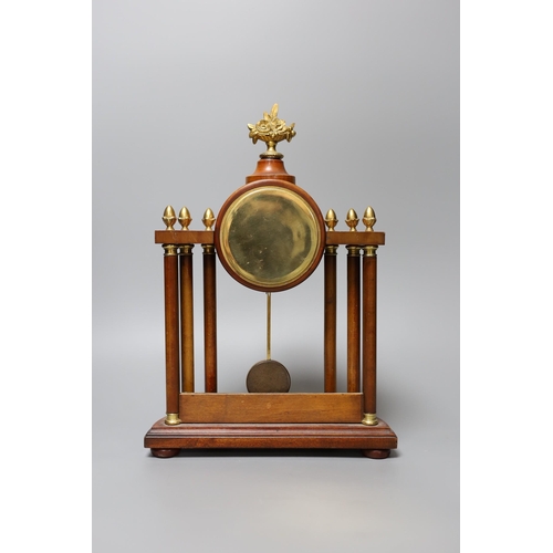 346 - A small French portico clock with column decoration, 29cm tall